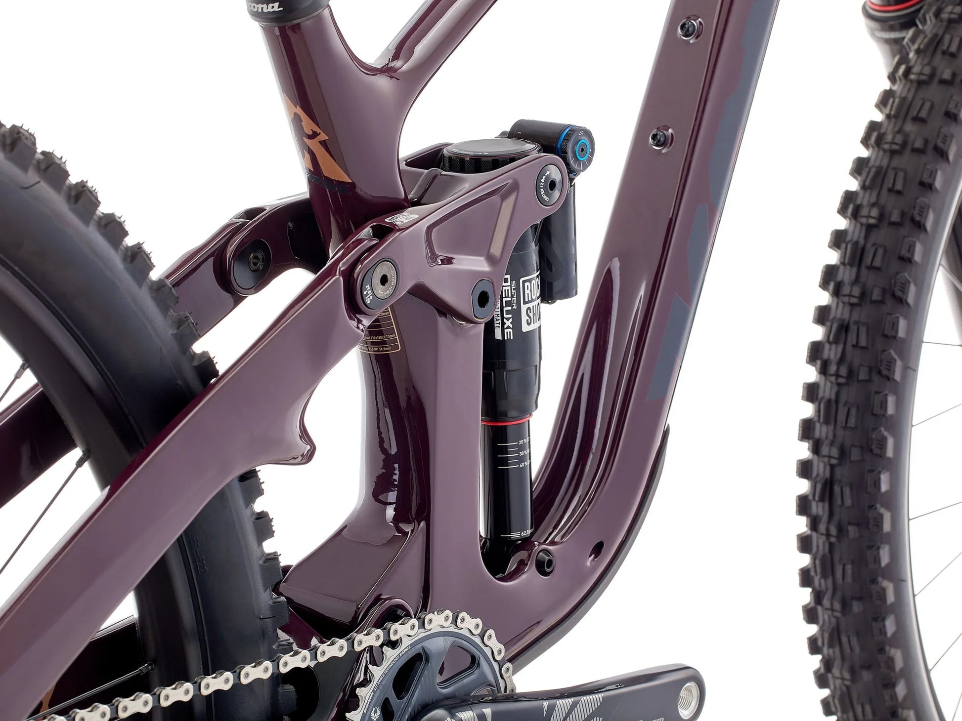 Close-up of a bicycle frame with suspension fork on a white background