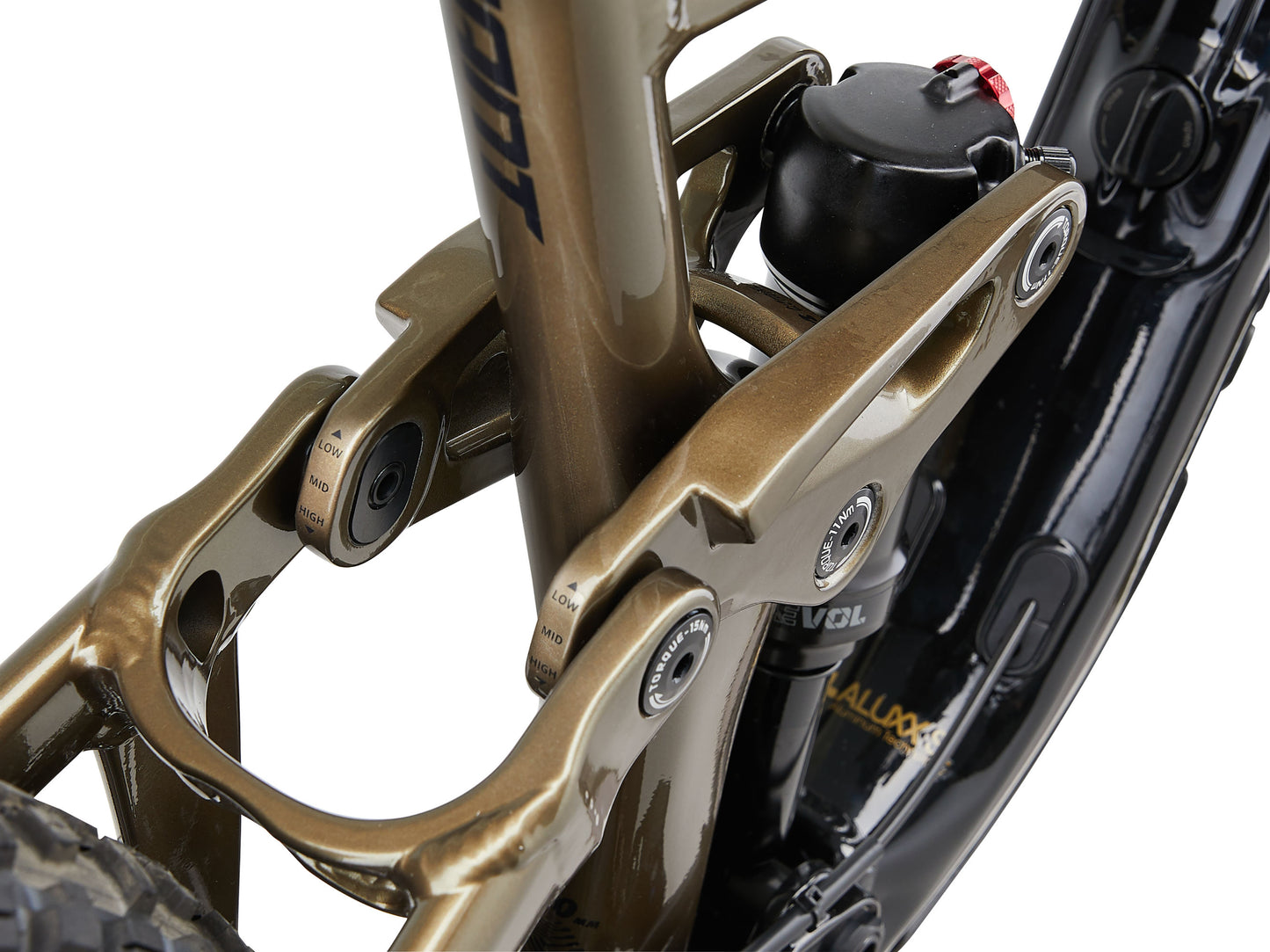 Close-up of a motorcycle suspension system with visible branding on a white background