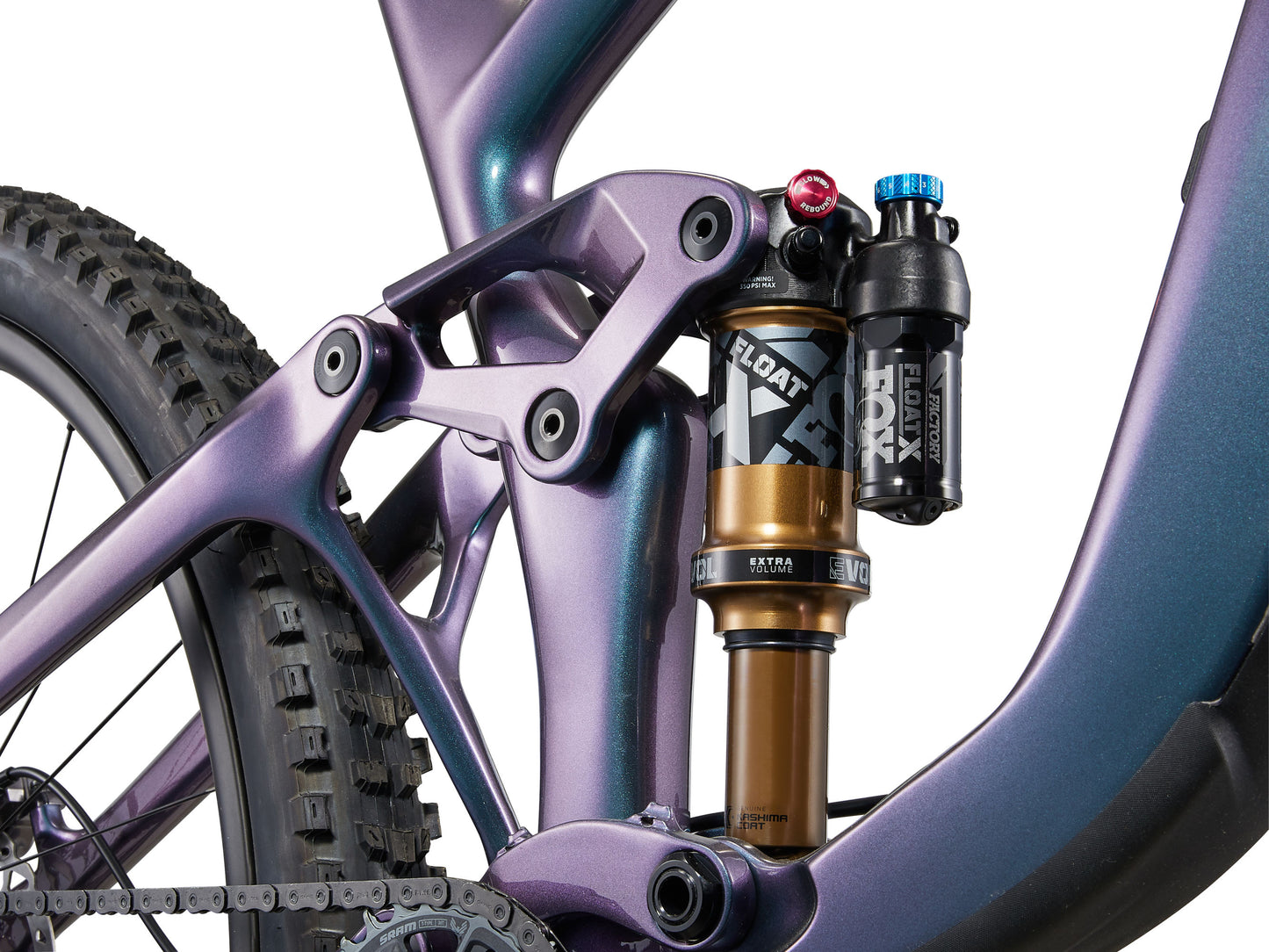 Close-up of a purple mountain bike with suspension fork and shock absorber on a white background