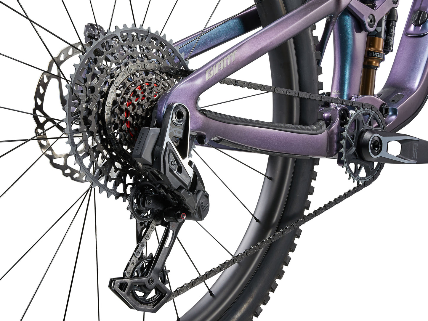 Close-up of a bicycle's gear system with a purple frame on a white background