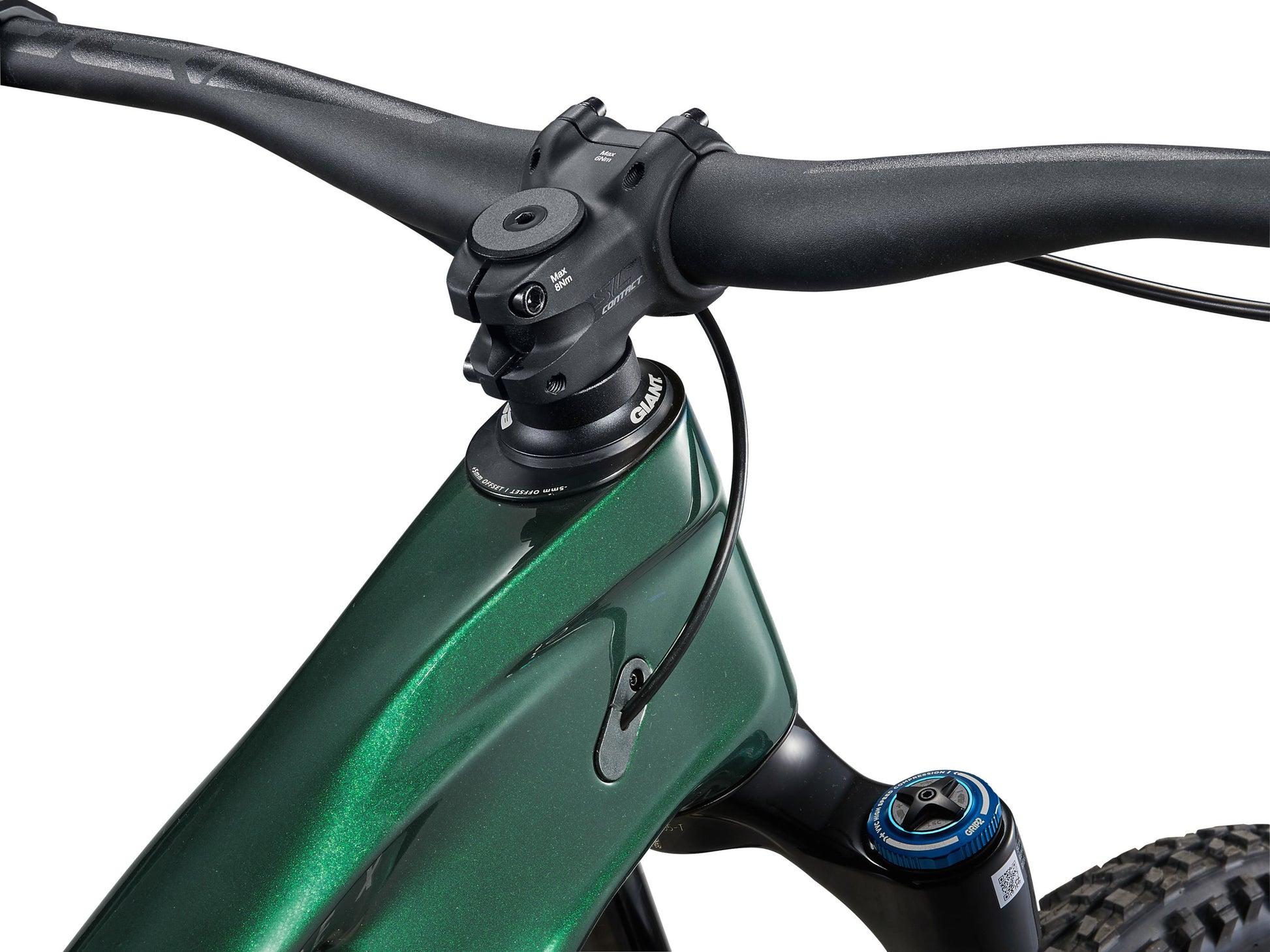 Close-up of a green bicycle handlebar with black grips on a white background