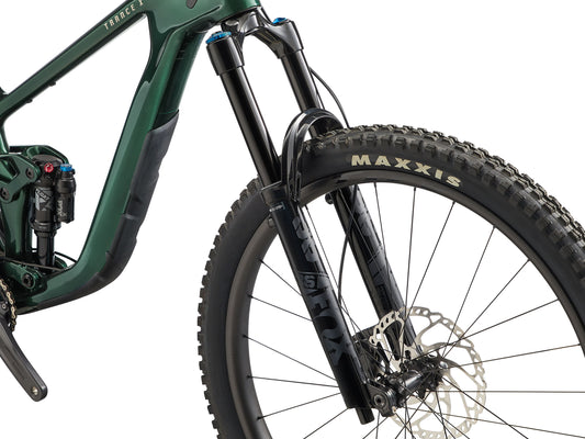 Green mountain bike with Maxxis tire on a white background