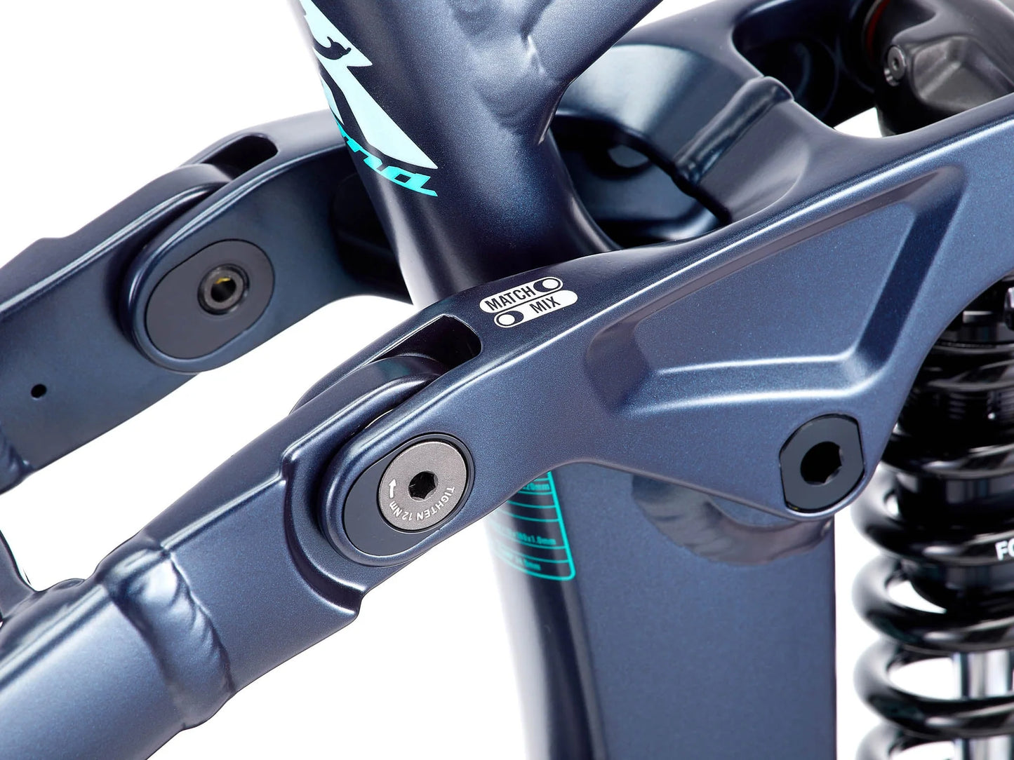 Close-up of a blue motorcycle suspension system with visible branding.