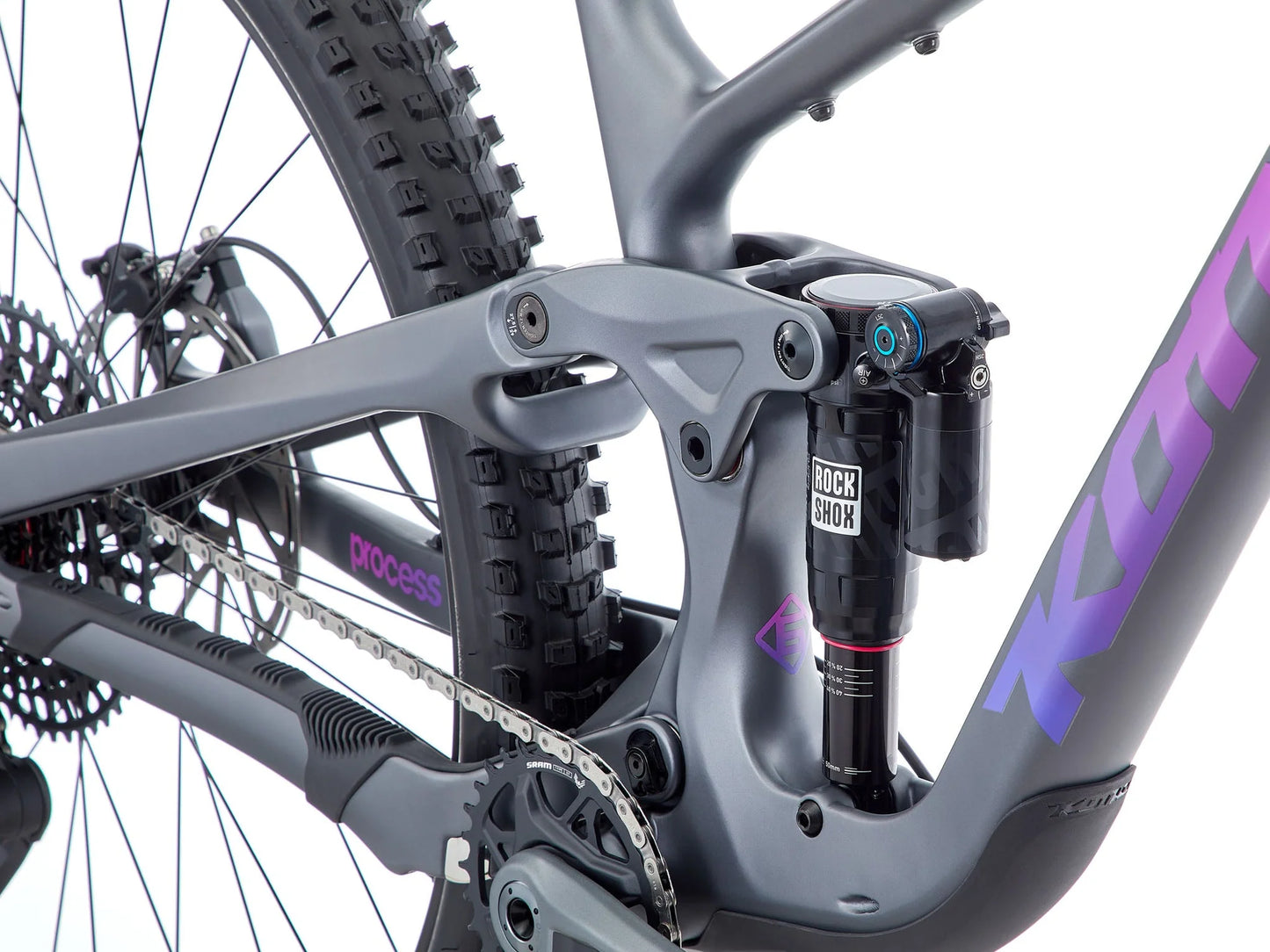 Close-up of a bicycle with a visible brand logo on a white background