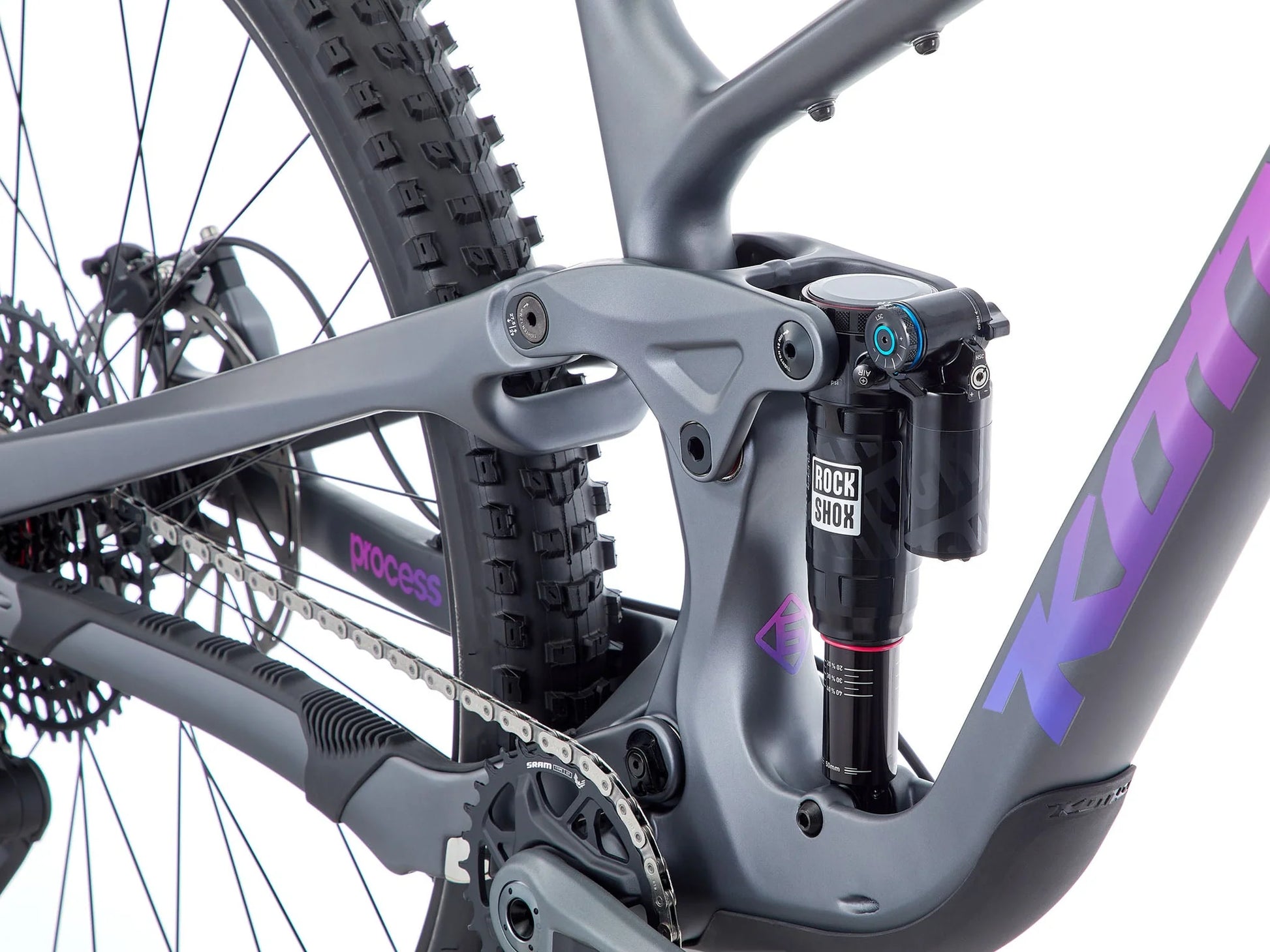 Close-up of a bicycle with a visible brand logo on a white background