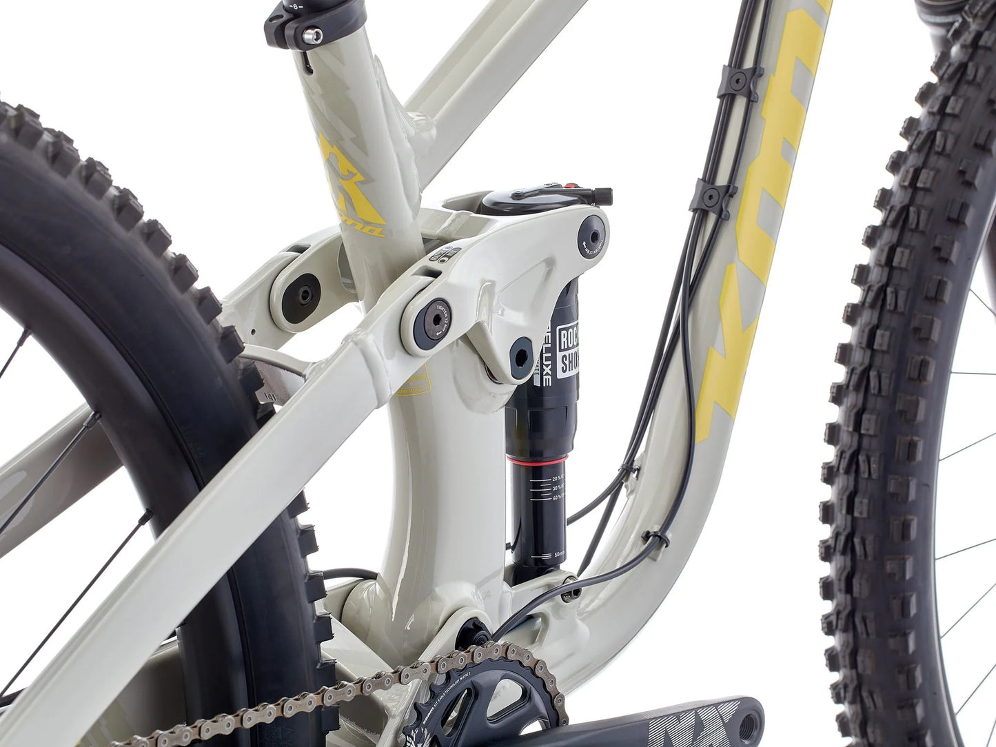 Close-up of a bicycle suspension fork and chain on a white background