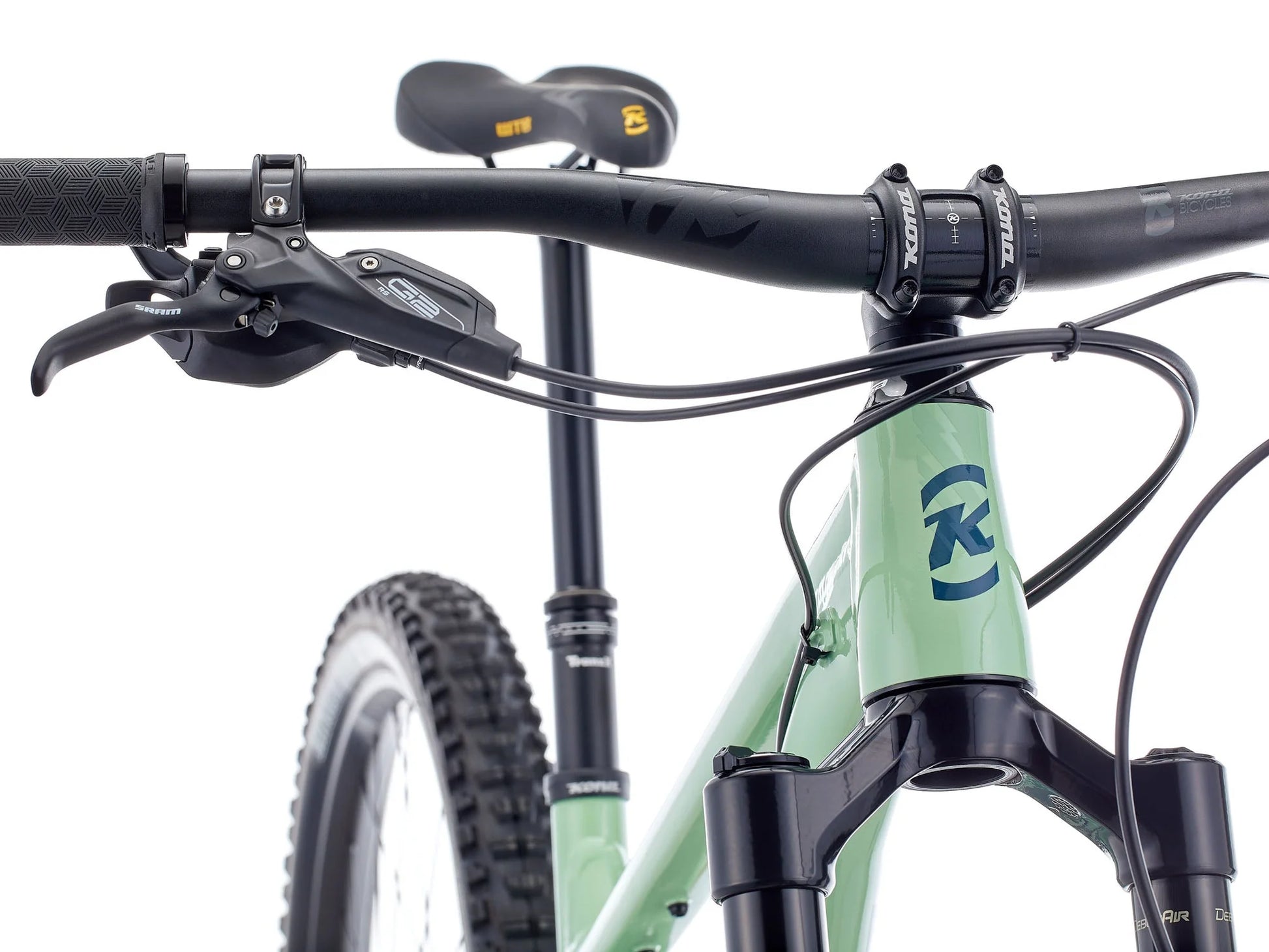 Close-up of a bicycle handlebar with a brand logo on a white background